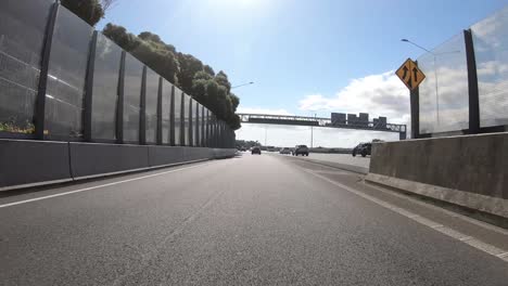 Hyperlapse-on-the-road-from-the-driver's-perspective,-from-city-road-to-motorway,-Auckland,-New-Zealand