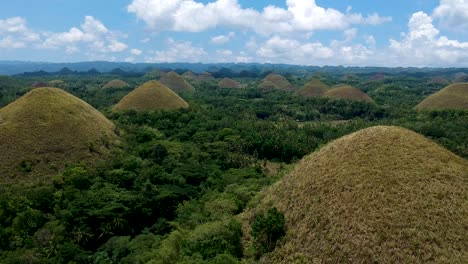 Aerial-wide-establishing-shot-of-Chocolate-Hills-viewing-complex,-Bohol,-Philippines