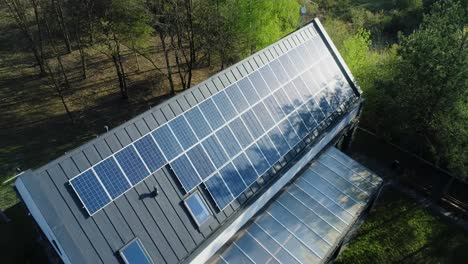 Flying-above-of-modern-house-with-solar-panels-on-roof