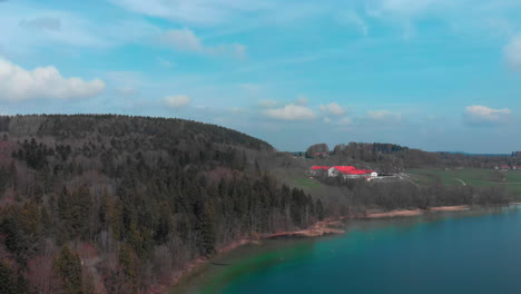 Aerial-approach-of-Gut-Kaltenbrunn-near-the-Tegernsee-with-crystal-clear-water