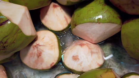 Zooming-out-from-the-bucket-full-of-coconut-fruit