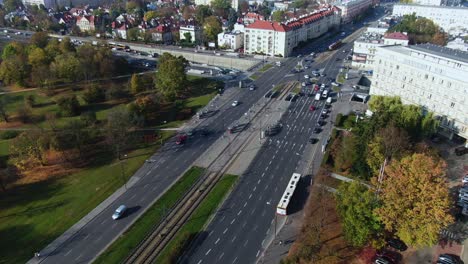 Aerial-of-the-traffic-in-the-Warsaw-city-centre,-Aleja-Armii-Ludowej-Highway-crossing,-eco-friendly-public-transportation