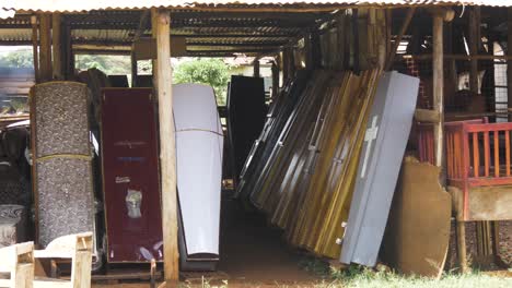 A-makeshift-coffin-shop-on-the-side-of-a-highway-selling-coffins-in-rural-Africa