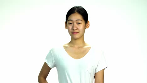 Young-Asian-20s-Woman-black-wrapped-hair-without-cosmetic-make-up-or-fresh-face-look-in-t-shirt-express-emotion-on-white-background-for-viral-clip-Casting-or-advertising