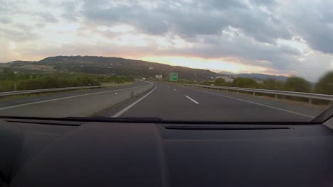 Beautiful-sunset-and-mountain-line,-while-driving-on-the-autobahn-between-Thessaloniki-and-Ioannina-in-the-northwest-region-of-Greece-through-the-Pindos-mountains