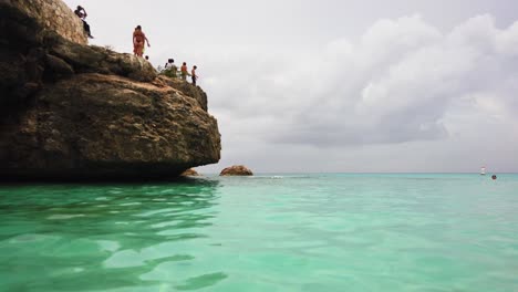 Cliff-jumping-at-this-amazing-beach-Grote-Knip-in-the-Dutch-Caribbean,-Curacao