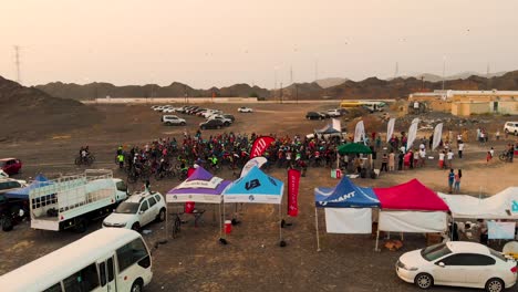 Mountain-bikers-gathering-at-the-starting-line-of-a-race-in-Showka,-Dubai,-United-Arab-Emirates