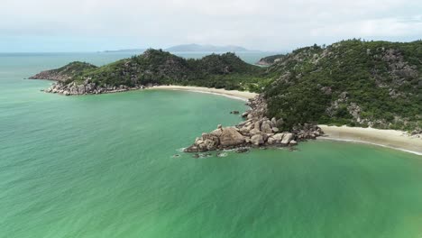 Fly-above-Magnetic-Island,-paradise-island-in-a-tropical-heaven