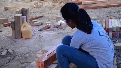 A-girl-cutting-a-woodblock-at-a-workshop-conducted-during-an-architectural-college-fest-in-Kerala