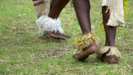 Close-up-legs-and-feet-of-male-sing-sing-dancers,-Papua-New-Guinea