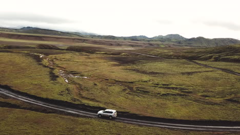 Four-Wheel-SUV-Vehicle-on-Rough-Road-on-Iceland-Countryside-and-Lava-Field-in-Fjallabak-Nature-Reserve