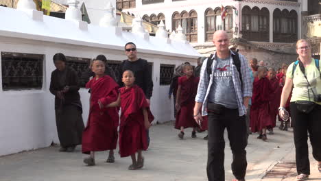 Kathmandu,-Nepal---November-16,-2019:-A-group-of-novice-monks-walking-around-the-Bouddha-in-Kathmandu