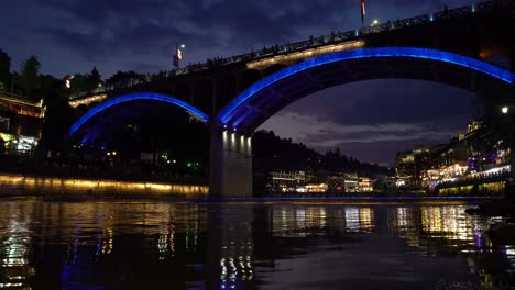 Old-historic-arched-road-bridge-over-Tuo-river,-flowing-through-the-centre-of-Fenghuang-Old-Town,-China