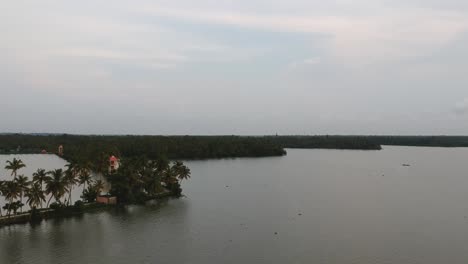 Beautiful-aerial-shot-of-a-backwater,shore-of-vembanad-lake,-canal,-sunset