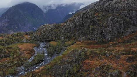 Dramatic-aerial-flying-over-river-in-the-high-mountains-of-Norway
