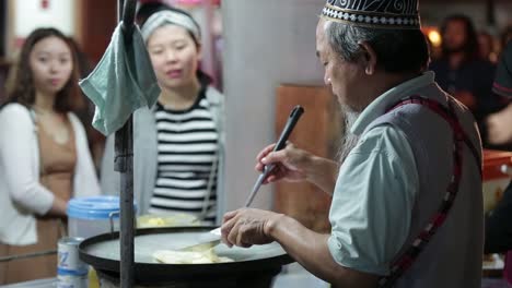 Street-Vendor-Selling-Roti--at-Night-Market