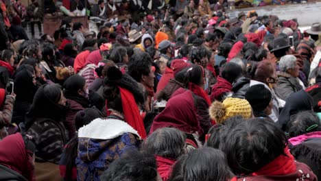 People-gathering-to-watch-and-catch-a-glimpse-of-the-traditional-colorful-Cham-dance-during-a-festival---Wide-shot