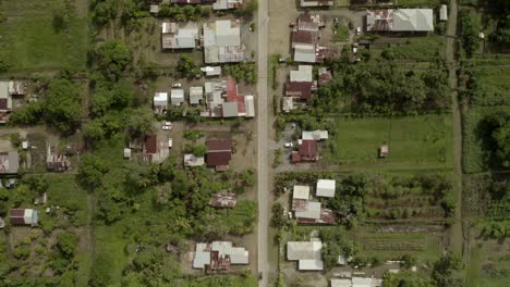Remote-suburban-town-on-edge-of-rainforest-in-Java,-aerial