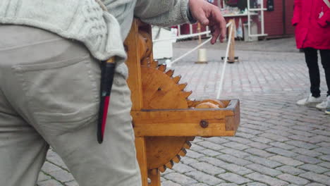 Man-working-on-a-rope-making-machine