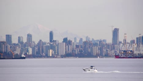 Densely-populated-city-skyline-of-Vancouver-from-port,-medium-shot