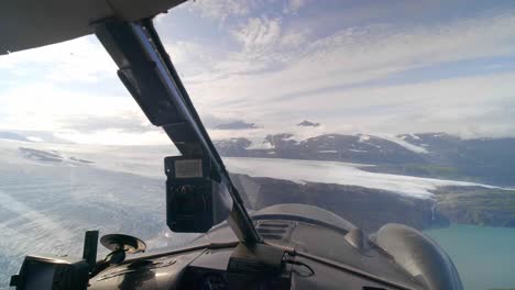 Airplane-Cockpit-POV-of-Glaciers-and-Mountains-of-Alaska-on-Sunny-Day