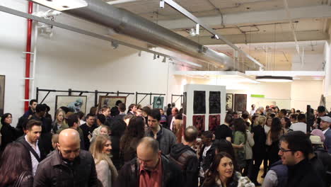 Wide-Shot-of-Crowd-at-a-New-York-City-Art-Show-Gallery