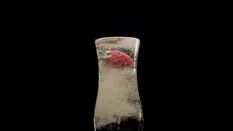Strawberry-in-champagne-flute-at-slow-motion