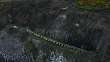 Aerial-view-of-the-train-passing-through-the-tunnels-of-The-Bray-mountains