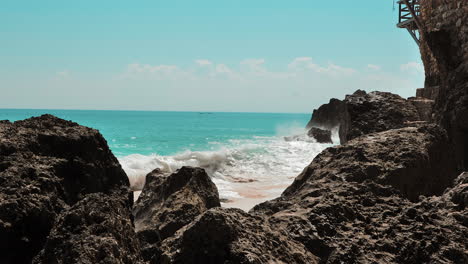 Huge-aqua-waves-crashing-on-rocks