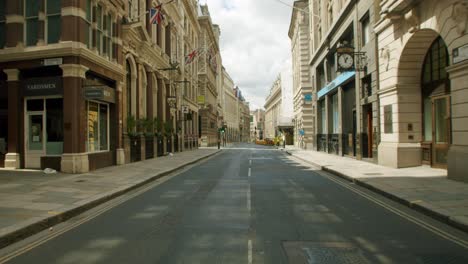 Empty-City-of-London-streets-with-closed-retail-shops-in-the-midday-sun,-during-the-Coronavirus-lockdown-pandemic-2020