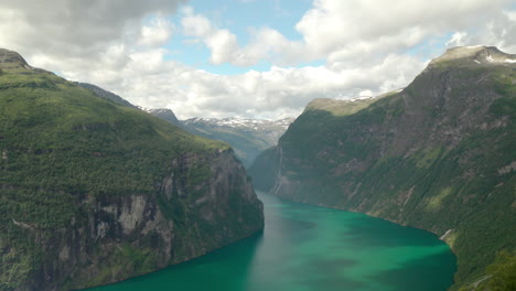 Bird's-Eye-View-Of-Geiranger-Fjord-With-Calm-Green-Water-By-The-Mountains-At-Daytime-In-Norway