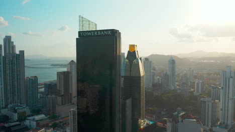 Vista-Aérea-De-Los-Rascacielos-Towerbank-Y-Evolution-Tower-Al-Amanecer-En-La-Ciudad-De-Panamá,-Panamá