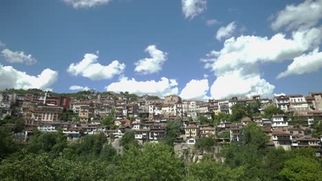 very-slow-left-to-right-pan-of-old-terraced-architectural-buildings-built-on-steep-sided-cliff-Veliko-Tarnovo