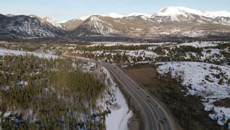 4K-drone-video-time-lapse-of-cars-driving-in-Rocky-Mountains-during-winter-in-Colorado