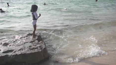 Cinematic-shot-of-kids-playing-at-the-shore