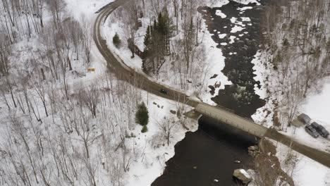 Bridge-crossing-the-Pleasant-river-near-Katahdin-Ironworks-in-Winter-snow