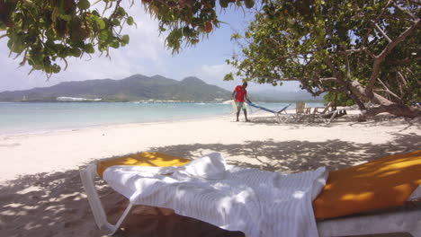 Wide-Panoramic-panning-shot-of-Dominican-Holiday-Resort-Staff-Working-on-Beach-at-Playa-Teco-Maimon