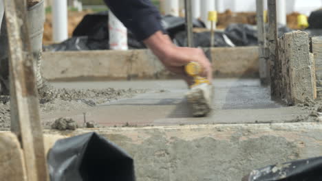SLOW-MOTION-Contract-Worker-Smoothing-Out-New-Wet-Cement-On-Slab