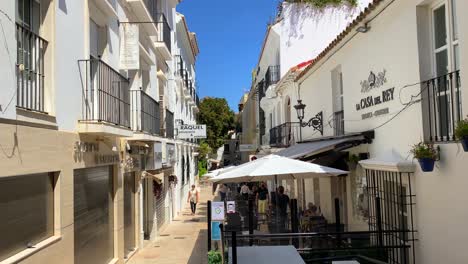 Typical-Spanish-street-in-old-city-Estepona-with-houses,-restaurants-and-businesses