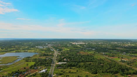 Nature-green-forest-aerial-view-with-swamp-countryside-road-and-blue-sky-day-in-Khonkaen,-Thailand