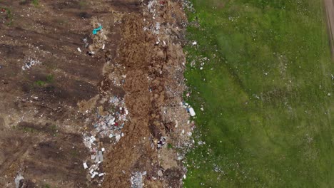 Environmental-Pollution---Garbage-Dump-In-The-Field---aerial-top-down