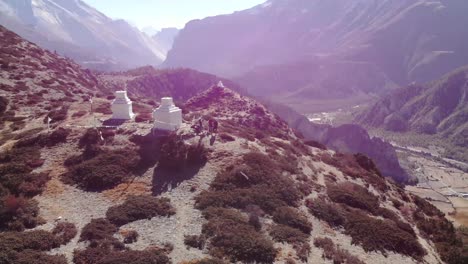 Small-Temple-At-The-Patched-Hills-Overlooking-The-Mountain-Range-Within-Annapurna-Circuit-In-Nepal