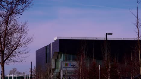 Afternoon-time-lapse-of-futuristic-Edmonton-Public-Library-during-a-balmy-winter-afternoon-as-the-weather-changes-to-an-almost-summer-hot-feeling-in-Millwods-Northern-Parking-area-of-the-mall-1-2