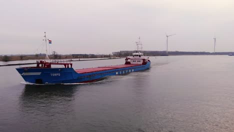 Aerial-Tracking-Shot-Of-Torpo-Cargo-Ship-Off-The-Forward-Bow-Along-Oude-Maas