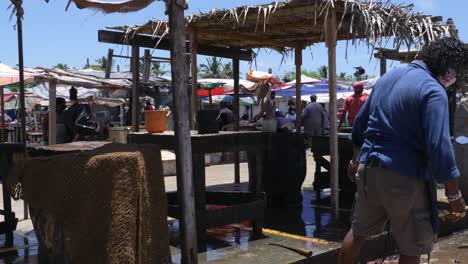 Walking-through-the-local-outdoor-fish-market-in-Negombo,-Sri-Lanka