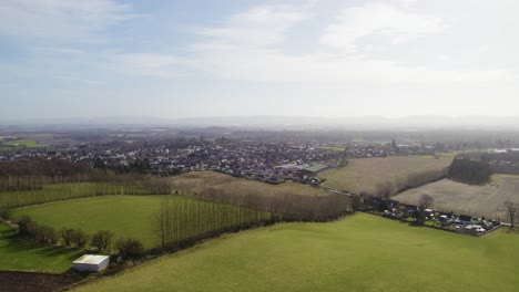 A-rising-aerial-drone-view-looking-over-the-fields-beside-Blairgowrie-and-Rattray-in-Perthshire,-Scotland