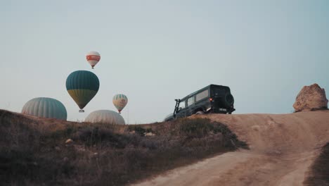 A-steadicam-shot-of-a-Jeep-driving-into-a-hot-air-balloon-festival-in-Arizona