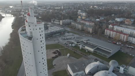 Drone-shot-of-Tartu-downtown-Snail-tower,-Ahhaa-Science-center,-Aura-waterpark,-Zepelinn