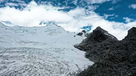 Huge-glacier-in-the-Andes-of-Peru-is-quickly-melting-do-to-global-warming---aerial-flyover-pull-back-view