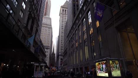 Big-building-in-Wall-Street-finance-stock-market-looking-up-view-narrow-street